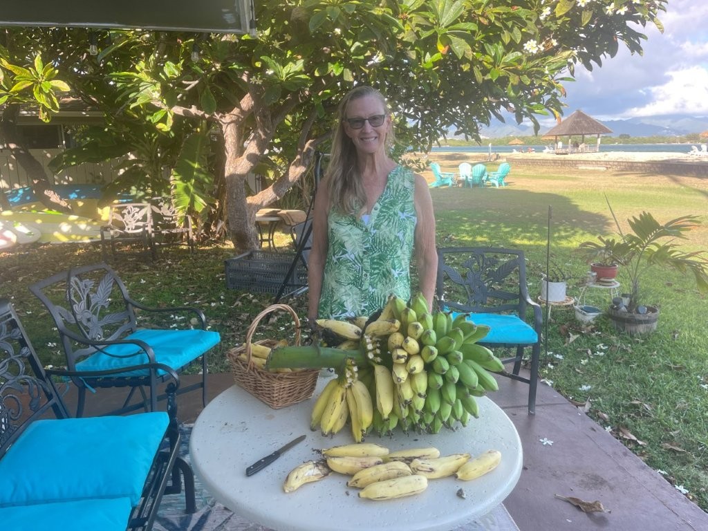 Deanna displaying a harvest from her gardening Deanna displaying a harvest from her gardening