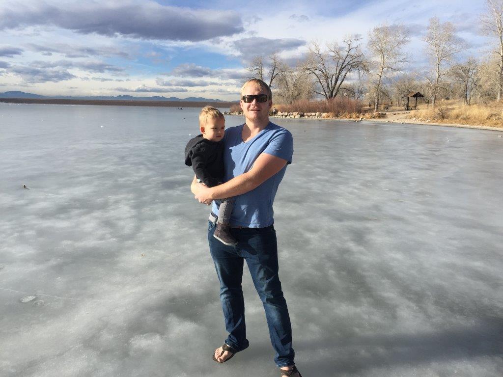 Kirk holding Hudson on frozen Cherry Creek Reservoir
