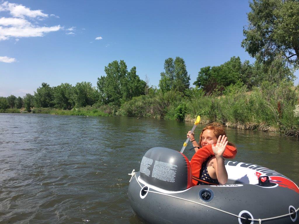 Riley floating down the South Platte River