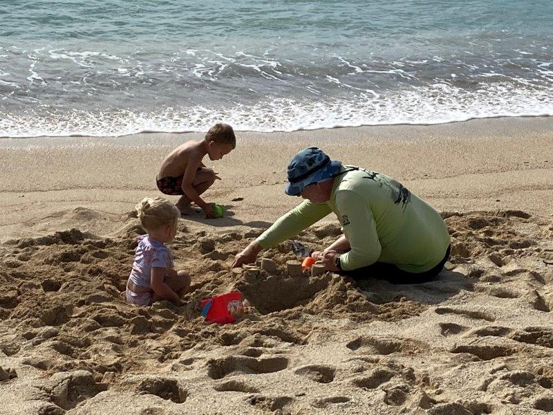 Hudson and Brooklyn building sand castles with Grumps