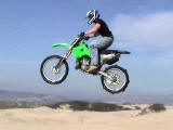 Chad in the Pismo dunes on his KX-250