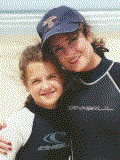 Audria and Cindy Shaeffer surf Pismo